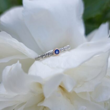 Silver, gold, sapphire