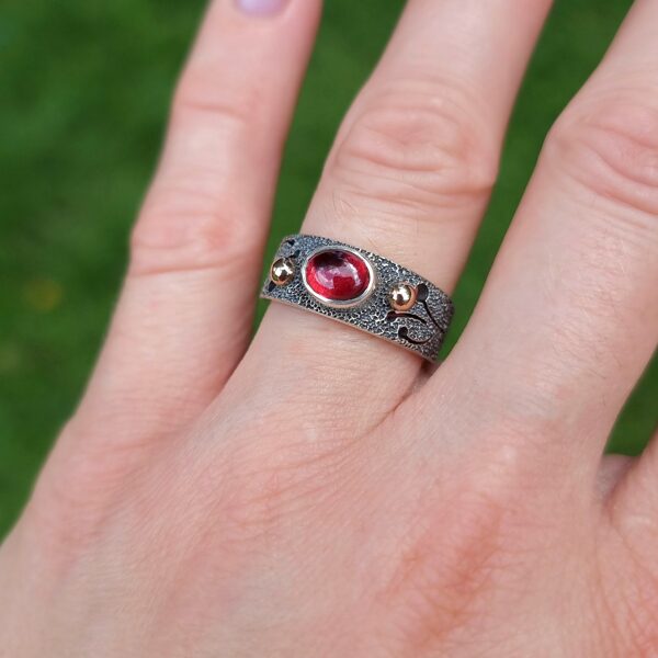 Silver, gold, garnet