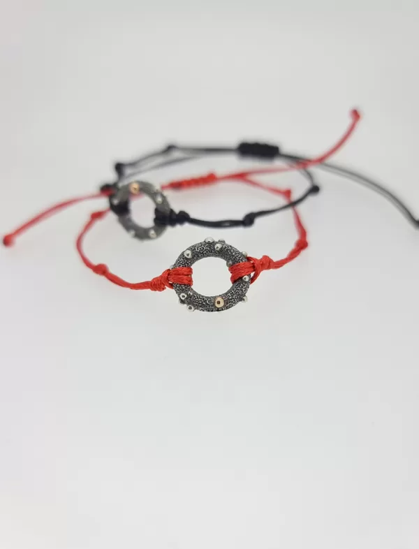 Silver, gold, waxed string