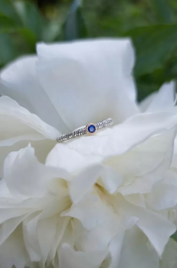 Silver, gold, sapphire