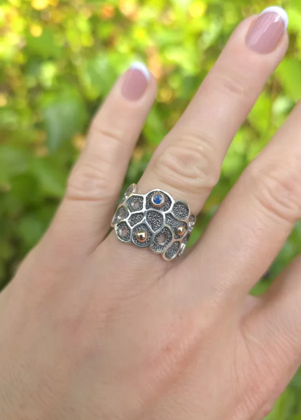 Silver, gold, sapphire