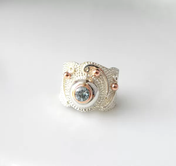 Silver, gold, topaz